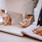 Bride and Groom signing Marriage Certificate