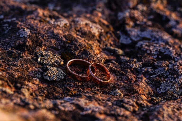 Two wedding rings on a rock